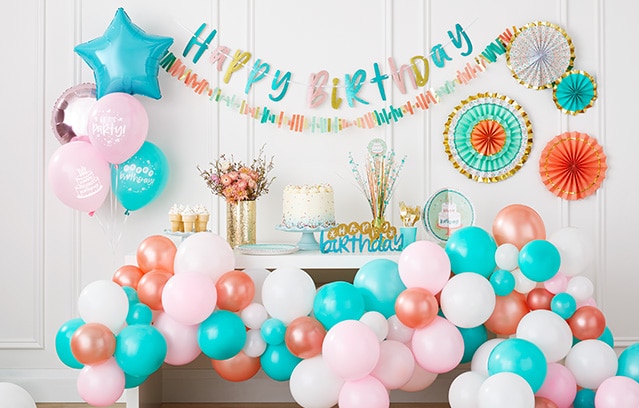 Happy birthday sign with balloons and cake 